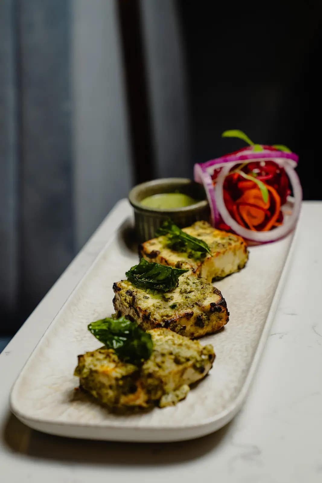 Chargrilled paneer tikka with pickled onion