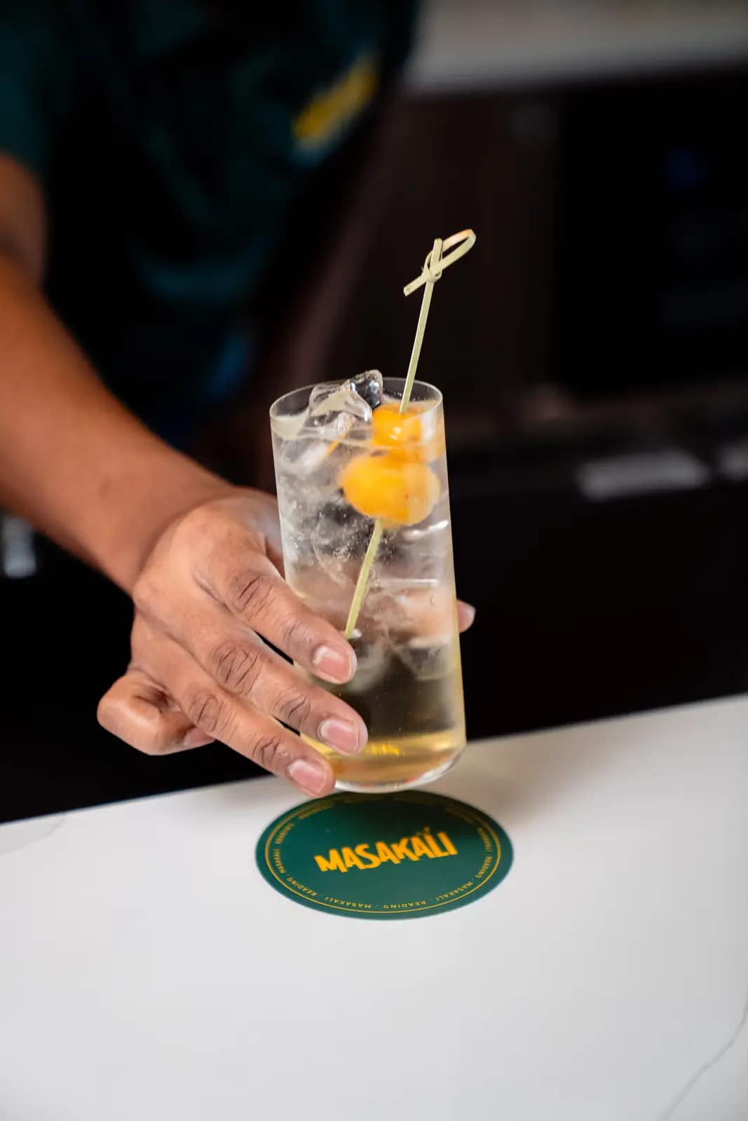 A Masakali cocktail served on a branded coaster in Reading